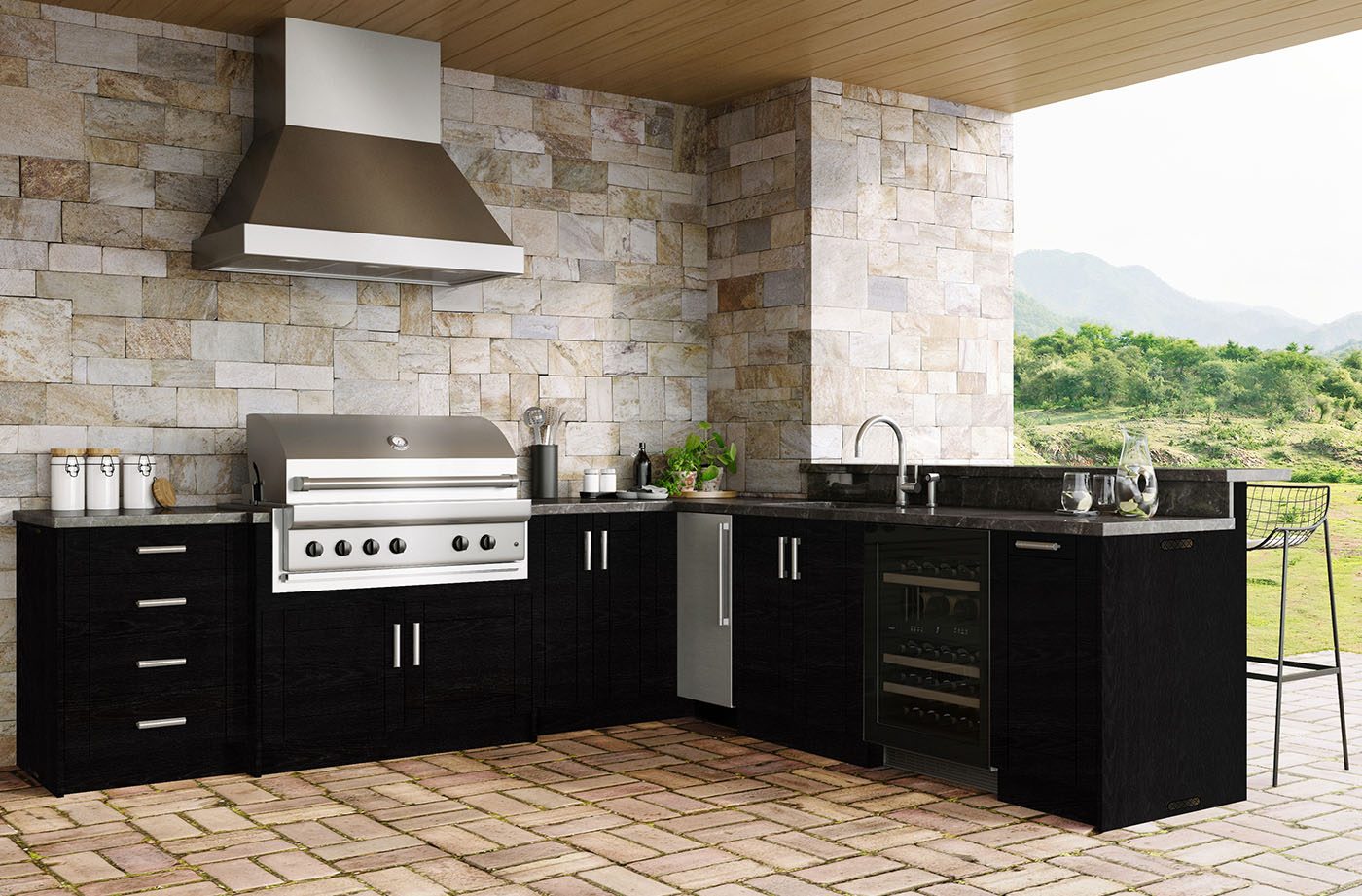 Outdoor kitchen cabinets with stone grill surround