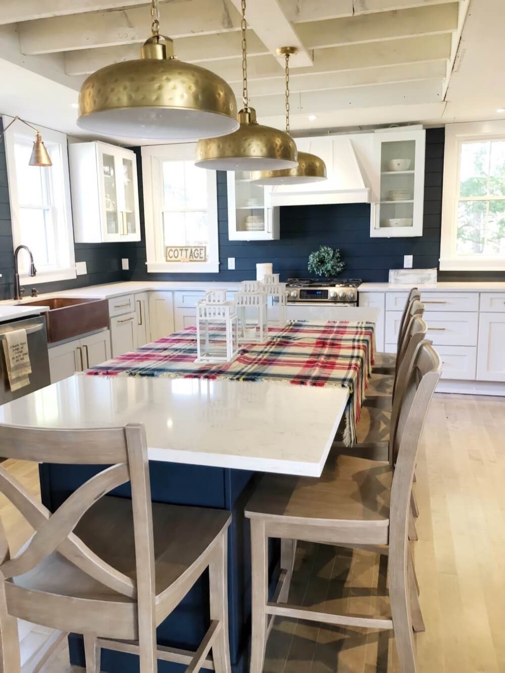 Weather-resistant outdoor kitchen cabinets on a Florida lanai with stainless grill insert