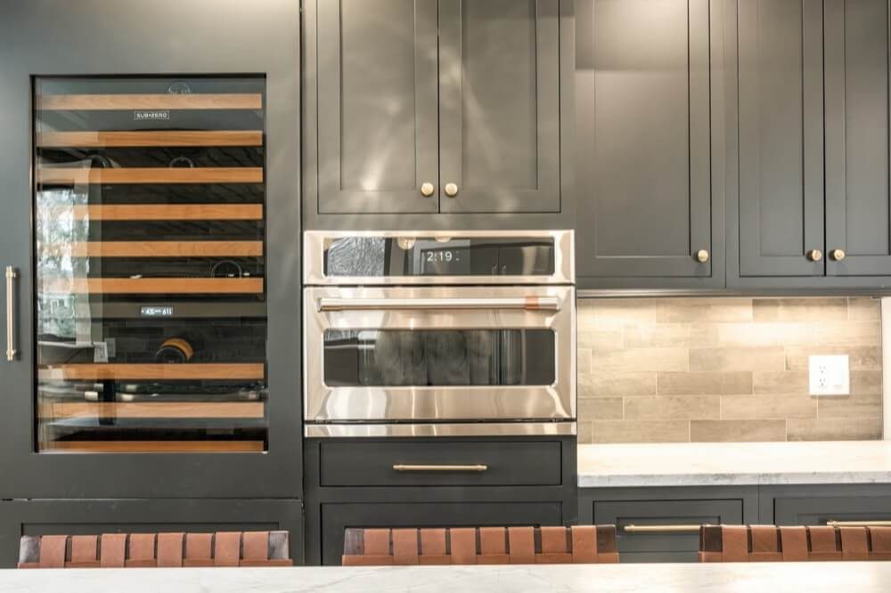 Kitchen with custom hood and coordinating cabinetry